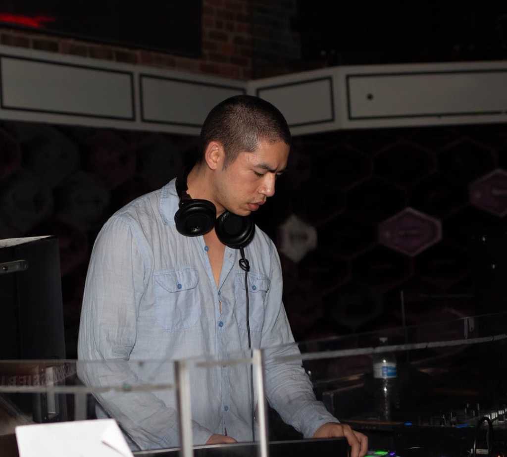 Kyle JK DJing and using audio equipment